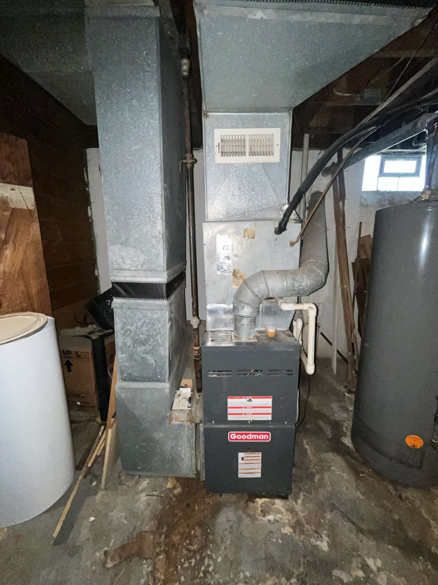 Aging furnace replacement in a basement before work