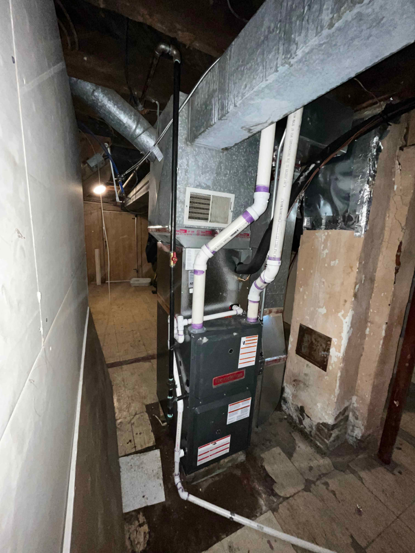 Basement furnace install in a tight space — Properly vented furnace fit into a narrow mechanical area