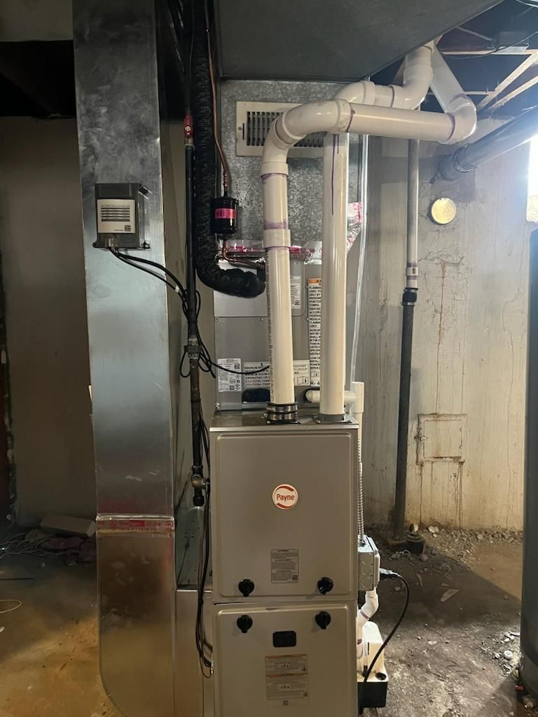 Aging furnace replacement in a basement after work
